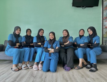 employee-in-millennium-care-dental-group-photo-in-blue-uniform